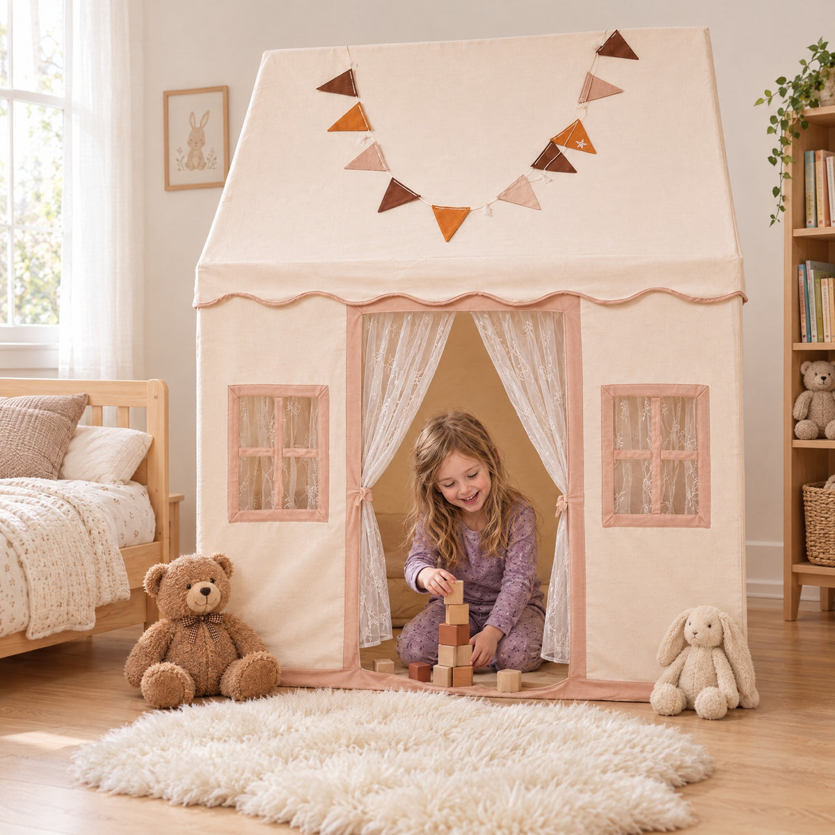 Girl playing with blocks inside the Momi Toys cotton play tent playhouse in a bright kids bedroom