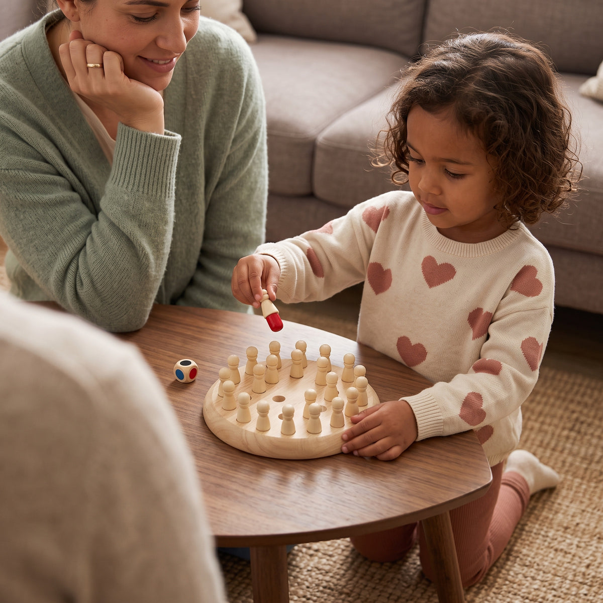 Girl and mum playing the Momi Toys Wooden Memory Game