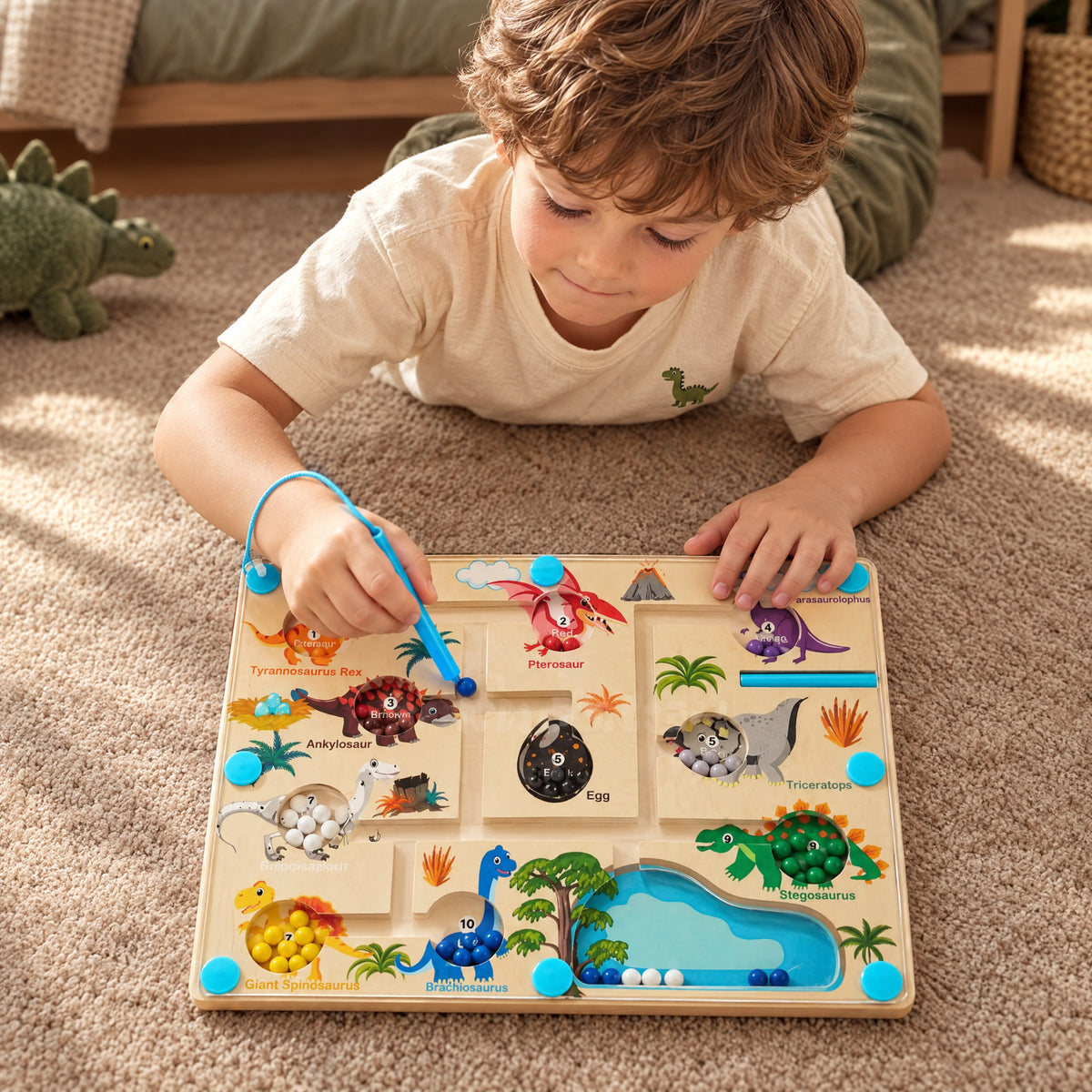 Child playing with the Momi Toys magnetic dinosaur color maze lifestyle photo