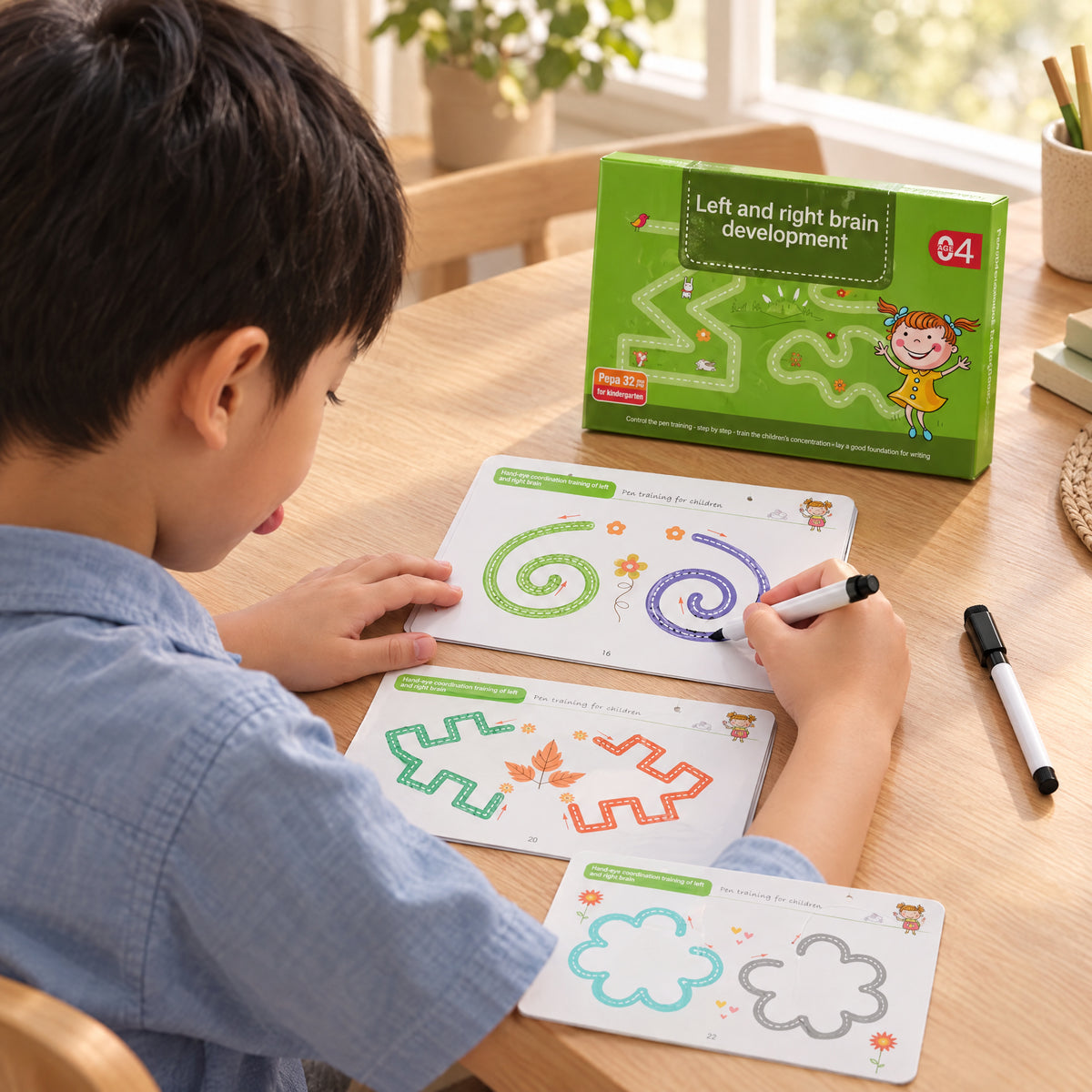 Child using the Momi Toys reusable writing workbook left and right brain development lifestyle photo